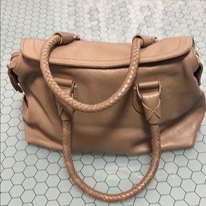 Beige leather Cole Haan bag.